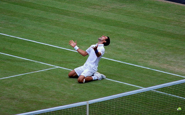 Serbian Novak Djokovic is in ecstasy after winning the semi-final of the 2011 Wimbledon. He would go on to lift the trophy after defeating Spaniard Rafael Nadal in the final. Image courtesy of Wikipedia Foundation