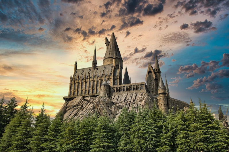 A beautiful old castle on a hill, looks like Hogwarts